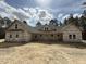 New construction home with a gray roof, covered in house wrap, and set on a large lot with some trees at 1275 Cameron Hill Rd, Cameron, NC 28326