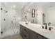 Modern bathroom featuring a glass shower and double vanity at 14020 Durant Rd, Raleigh, NC 27614