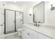 Bathroom featuring glass shower doors, modern fixtures, and white vanity at 14020 Durant Rd, Raleigh, NC 27614