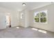 Bedroom featuring natural light and neutral carpeting at 14020 Durant Rd, Raleigh, NC 27614