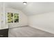 Well lit bedroom with an eye-catching vaulted ceiling for unique design at 14020 Durant Rd, Raleigh, NC 27614