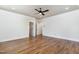 Bright bedroom boasts hardwood floors and a ceiling fan at 14020 Durant Rd, Raleigh, NC 27614