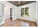Well-lit bedroom featuring hardwood floors, decorative ceiling, and large windows at 14020 Durant Rd, Raleigh, NC 27614