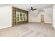 Bedroom featuring custom built-ins that surround the window and an elegant ceiling fan at 14020 Durant Rd, Raleigh, NC 27614