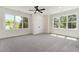 Spacious bedroom featuring large windows offering an abundance of natural light at 14020 Durant Rd, Raleigh, NC 27614