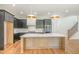 Contemporary kitchen featuring a large island with quartz countertop and stainless steel appliances at 14020 Durant Rd, Raleigh, NC 27614