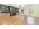 Spacious living room featuring hardwood floors, a fireplace with custom built-ins, and natural light at 14020 Durant Rd, Raleigh, NC 27614