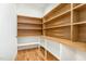 Walk-in pantry with wooden shelving and storage space at 14020 Durant Rd, Raleigh, NC 27614