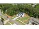Aerial shot of new construction home featuring large manicured lawn and mature trees at 100 N Ridge View Way, Franklinton, NC 27525