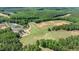 Aerial view of golf course with manicured greens, bunkers, and wooded surrounding at 100 N Ridge View Way, Franklinton, NC 27525