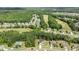 Aerial view of a Primary-planned community with golf course and mature trees at 100 N Ridge View Way, Franklinton, NC 27525