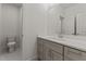 Bathroom featuring vanity with a marble countertop and brushed nickel hardware, with a connecting toilet room at 100 N Ridge View Way, Franklinton, NC 27525