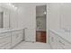 Elegant primary bathroom features marble floors, a double vanity, and opens into the primary bedroom at 100 N Ridge View Way, Franklinton, NC 27525