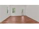 This bedroom features hardwood floors, natural light and an exterior door to the back porch at 100 N Ridge View Way, Franklinton, NC 27525