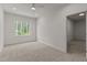 Bright bedroom with natural light from window and doorway leading to another room at 100 N Ridge View Way, Franklinton, NC 27525