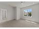 Neutral bedroom with walk-in closet and natural light from a window at 100 N Ridge View Way, Franklinton, NC 27525