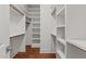 Walk-in closet with custom shelving and hardwood floors at 100 N Ridge View Way, Franklinton, NC 27525