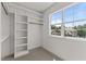 Walk in closet with window and custom built in shelving at 100 N Ridge View Way, Franklinton, NC 27525