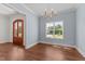 Light blue dining room offers an abundance of natural light and hardwood floors at 100 N Ridge View Way, Franklinton, NC 27525