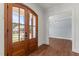 Warm and inviting foyer with hardwood floors and a view into the dining room at 100 N Ridge View Way, Franklinton, NC 27525