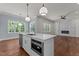 Modern kitchen island with white countertops and a stainless steel sink at 100 N Ridge View Way, Franklinton, NC 27525