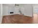 Spacious open-concept living room with modern fireplace and hardwood floors at 100 N Ridge View Way, Franklinton, NC 27525