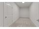 Compact, carpeted room showcasing a single door and simple design at 100 N Ridge View Way, Franklinton, NC 27525