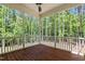 Spacious screened porch with wood flooring and natural views at 100 N Ridge View Way, Franklinton, NC 27525