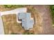 An aerial view shows the property layout and a large, well-maintained roof, highlighting curb appeal and structural integrity at 225 Whistlers Cv, Louisburg, NC 27549