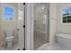 Contemporary bathroom with a glass-enclosed shower and a soaking tub at 225 Whistlers Cv, Louisburg, NC 27549
