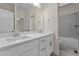 Bathroom featuring a double vanity with white cabinets, framed mirror, and a shower and tub combo at 225 Whistlers Cv, Louisburg, NC 27549