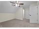 Bedroom featuring carpeted floors, closet, and ceiling fan with easy access to additional rooms at 225 Whistlers Cv, Louisburg, NC 27549
