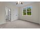 Comfortable bedroom with a large window and en-suite bathroom with double closet at 225 Whistlers Cv, Louisburg, NC 27549