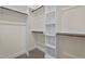 Walk-in closet with ample shelving and hanging space at 225 Whistlers Cv, Louisburg, NC 27549
