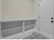 Functional entryway with built-in storage and decorative tile flooring at 225 Whistlers Cv, Louisburg, NC 27549