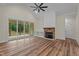Spacious living room with vaulted ceilings, fireplace, and sliding doors to a screened porch at 225 Whistlers Cv, Louisburg, NC 27549