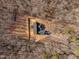 Aerial view of a new home surrounded by trees, displaying its architectural layout at 2817 Silk Hope Gum Springs Rd, Pittsboro, NC 27312