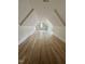 Bonus room showcasing finished hardwood floors and a large dormer window at 2817 Silk Hope Gum Springs Rd, Pittsboro, NC 27312