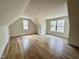 Bonus room featuring hardwood floors and natural light from two windows at 2817 Silk Hope Gum Springs Rd, Pittsboro, NC 27312