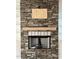 Close-up of the living room stone fireplace at 2817 Silk Hope Gum Springs Rd, Pittsboro, NC 27312