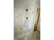 Modern shower featuring white marble tiling and dark fixtures at 2817 Silk Hope Gum Springs Rd, Pittsboro, NC 27312