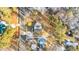 An aerial view showcases the property's location, nestled among trees near a quiet road at 5300 Pulley Town Rd, Zebulon, NC 27597