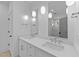 Bright bathroom with double sink vanity, modern pendant lighting, and updated fixtures at 5300 Pulley Town Rd, Zebulon, NC 27597