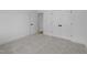 Spacious bedroom featuring plush carpeting, fresh white paint, and sleek paneled doors at 5300 Pulley Town Rd, Zebulon, NC 27597