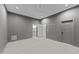 Large bedroom with ensuite bathroom access, neutral paint, modern ceiling fan, carpet floors, and recessed lights at 5300 Pulley Town Rd, Zebulon, NC 27597