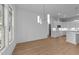 Open dining area showcasing modern light fixtures and seamless integration with the gourmet kitchen at 5300 Pulley Town Rd, Zebulon, NC 27597