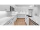 Contemporary kitchen features white cabinetry, quartz countertops, and sleek stainless steel appliances at 5300 Pulley Town Rd, Zebulon, NC 27597