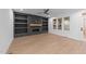 Bright living room featuring a cozy fireplace with custom built-ins and light wood flooring at 5300 Pulley Town Rd, Zebulon, NC 27597
