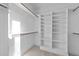 Organized walk-in closet featuring ample storage space and shelving at 5300 Pulley Town Rd, Zebulon, NC 27597