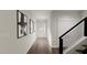 Elegant hallway with hardwood floors and modern wall art at 932 Myers Point Dr # 34, Morrisville, NC 27560